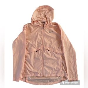 Used womens Nike essential zip up Running jacket peach color in small